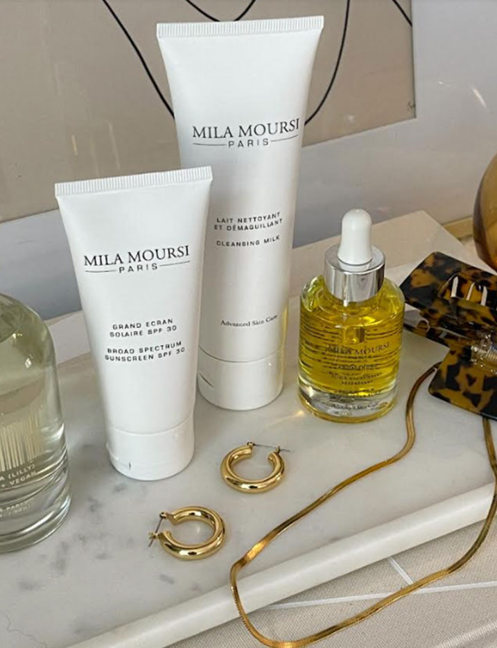 Bottles of Mila Moursi Paris sit on a marble tray.