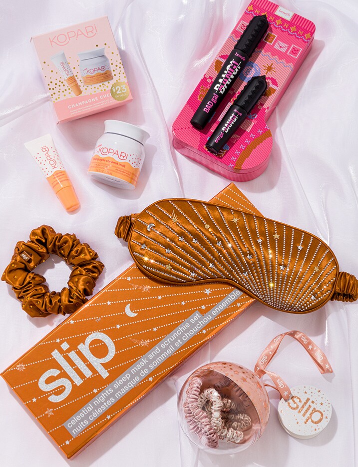 Variety of holiday gift sets from Slip brand, Kopari brand, and benefit cosmetics.