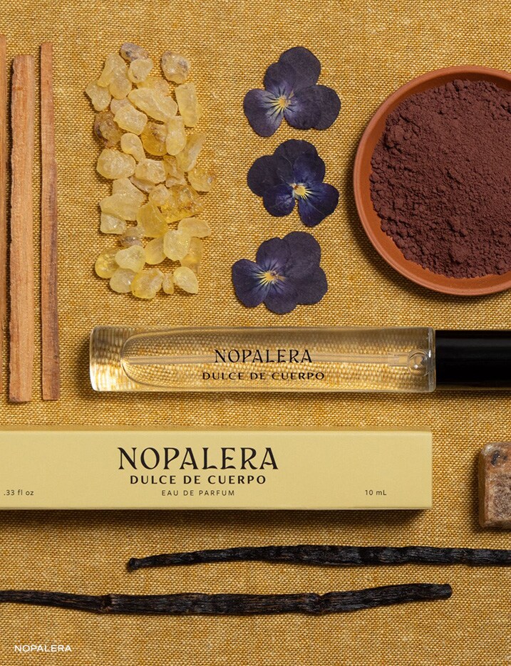 Bottle of 10mL NOPALERA Dulce De Cuerpo perfume surrounded by its scent notes.
