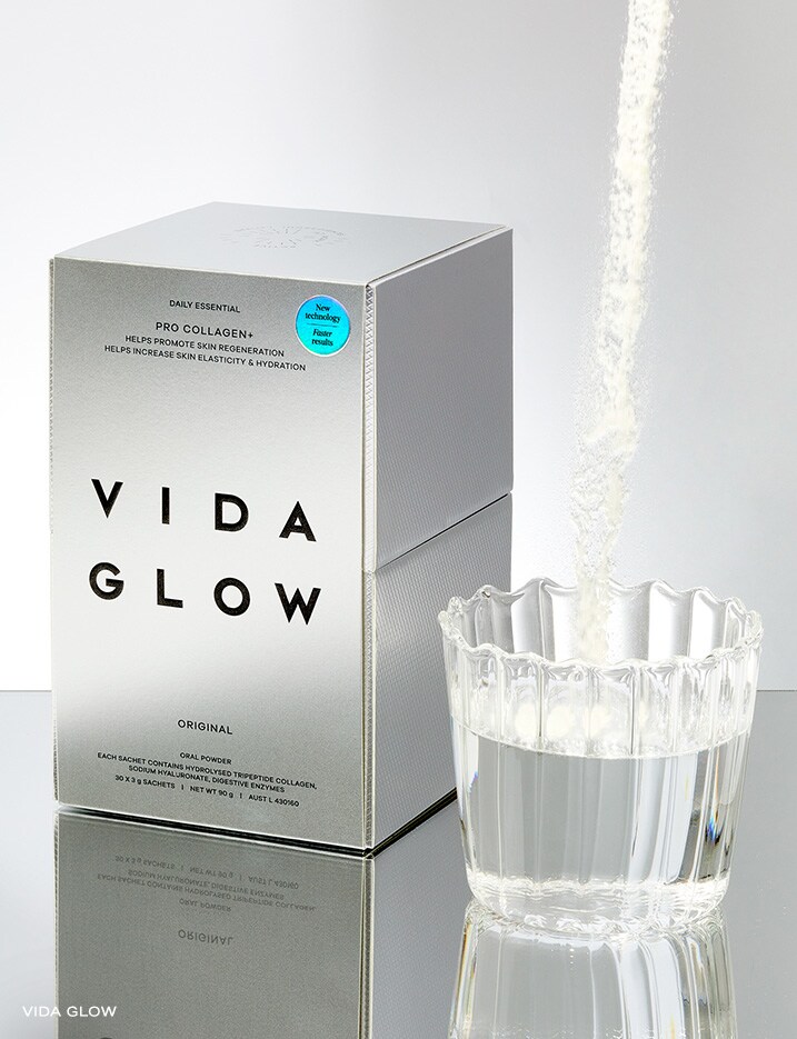 Vida Glow Pro Collagen+ Original Oral Powder poured into a glass of water.