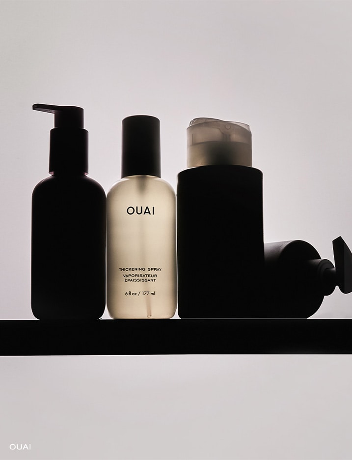 Highlighted bottle of Ouai Thickening Spray.