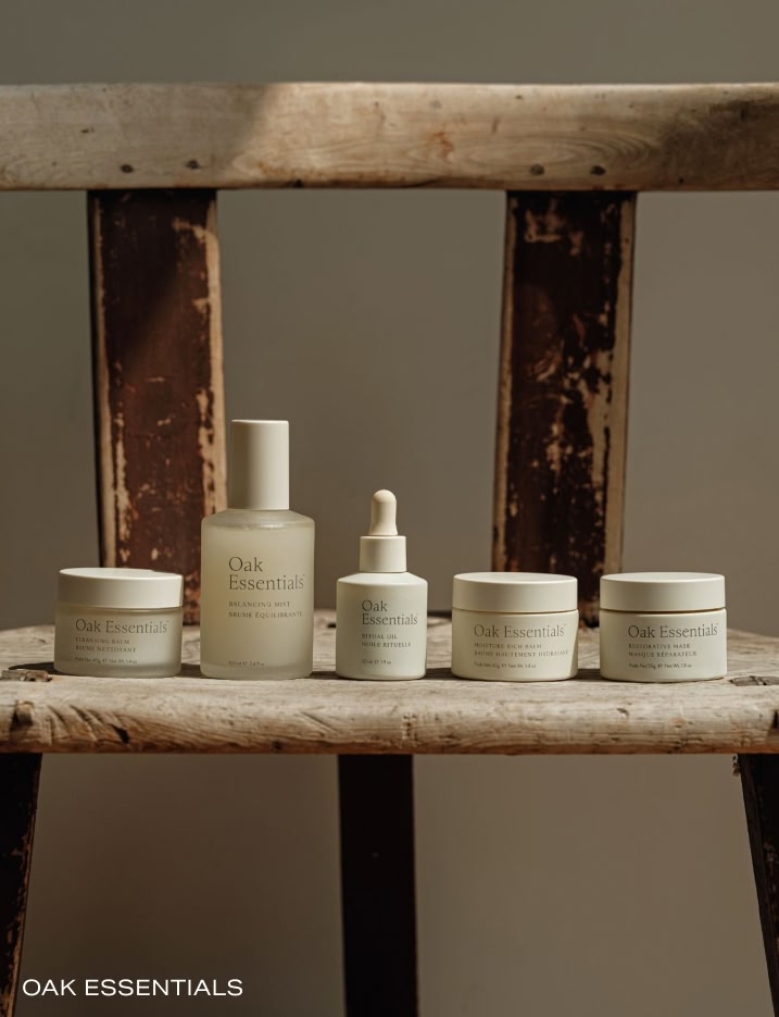 Row of Oak Essentials skincare placed on a wooden chair.