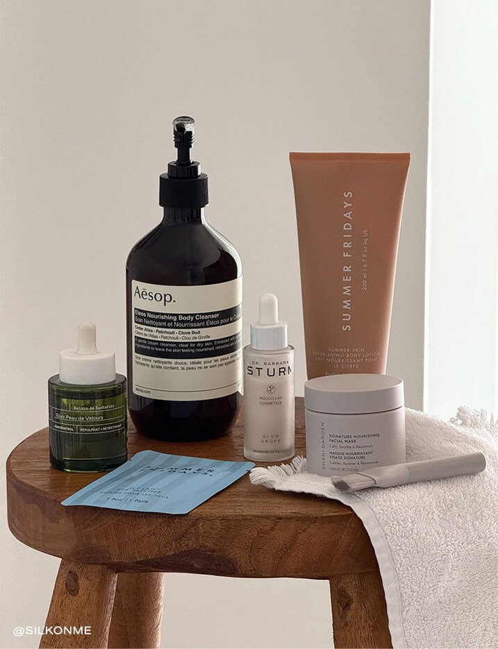 Variety of skincare on a wooden stool.
