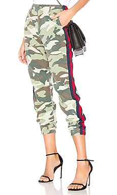 camo pants with red and blue stripe