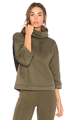 Puma Funnel Neck Hoodie in Olive Night REVOLVE