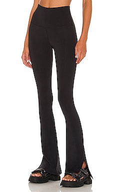 Black Spat slit-cuff polka-dot jersey leggings, Norma Kamali