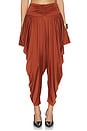 view 1 of 6 Pleated Fluid Jersey Shiny Pant in Rouge Ocre