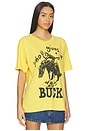 view 3 of 5 Who Gives A Buck Merch Tee in Yellow Gold