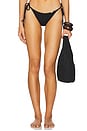 view 1 of 5 Seamless Wavy Ruched Back Brazilian Tie Side Bikini Bottom in Black