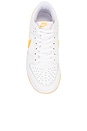 view 4 of 6 Dunk Low Retro Sneaker in White, University Gold, & Summit White