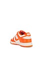 view 3 of 6 Nike Dunk Low Retro Sneakers in Pale Ivory & Safety Orange