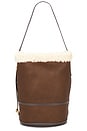 view 1 of 4 Shearling & Tumbled Leather Sling Bucket Bag Medium in Luggage & Cream