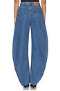 view 4 of 6 JEANS CON PERNERA ACAMPANADA DRAPED BARREL LEG JEANS in Medium Blue Denim