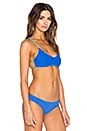 view 4 of 6 Ellie Reversible Halter Bikini Top in Royal Blue & Turquoise