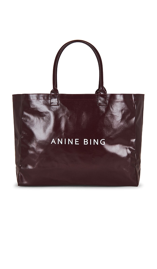 ANINE BING Leo Coated Canvas Tote Bag in Burgundy.