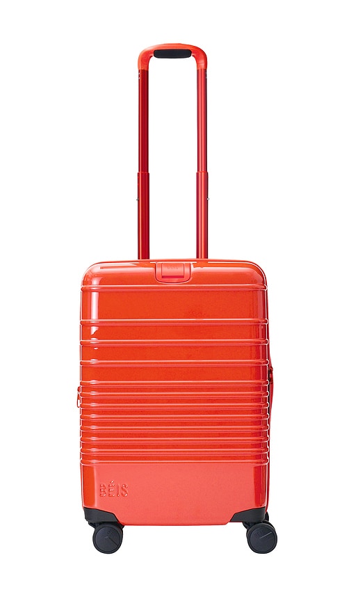 The Carry-on Roller Luggage in Orange.