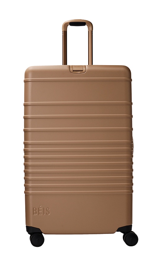 The Large Check-in Roller Luggage in Tan.