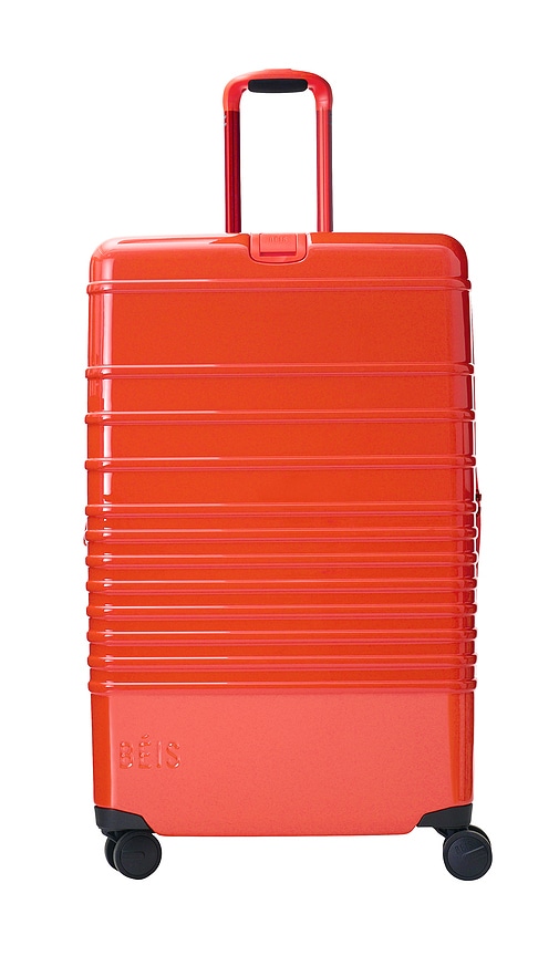 The Large Check-in Roller Luggage in Orange.