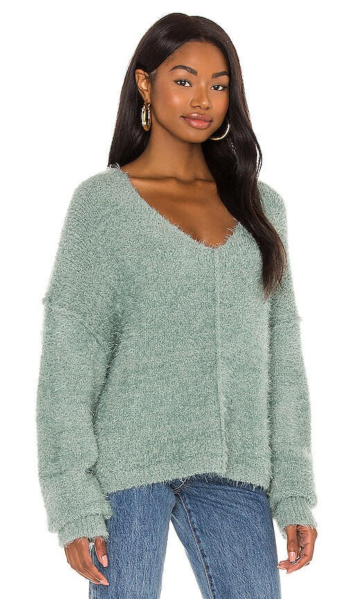 sweater on skirt