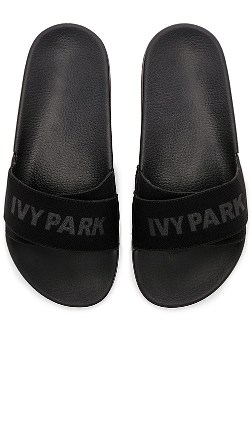 IVY PARK Logo Tape Slider in Black 