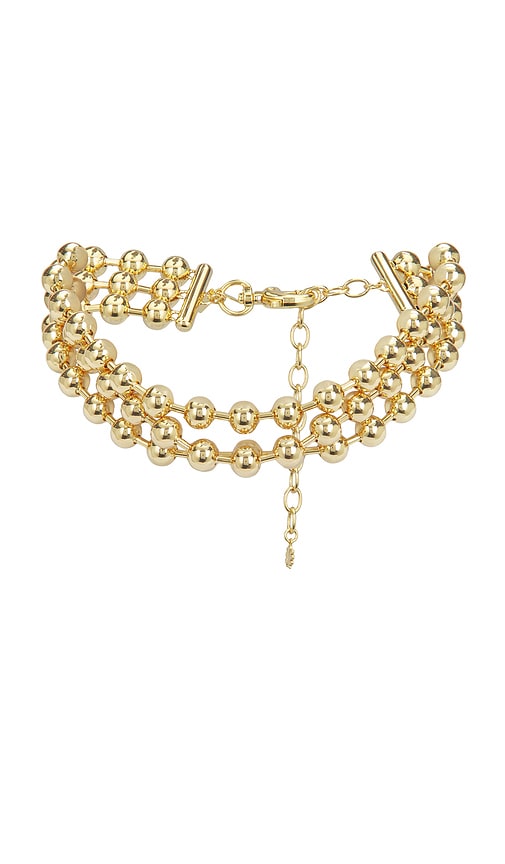 Lele Sadoughi COLLIER RAS-DE-COU DIANA TRIPLE ROW en Metallic Gold 275 €