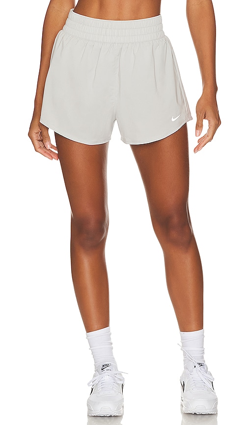 Nike One Dri Fit High Rise 3 Inch Short in Light Iron & Reflective ...