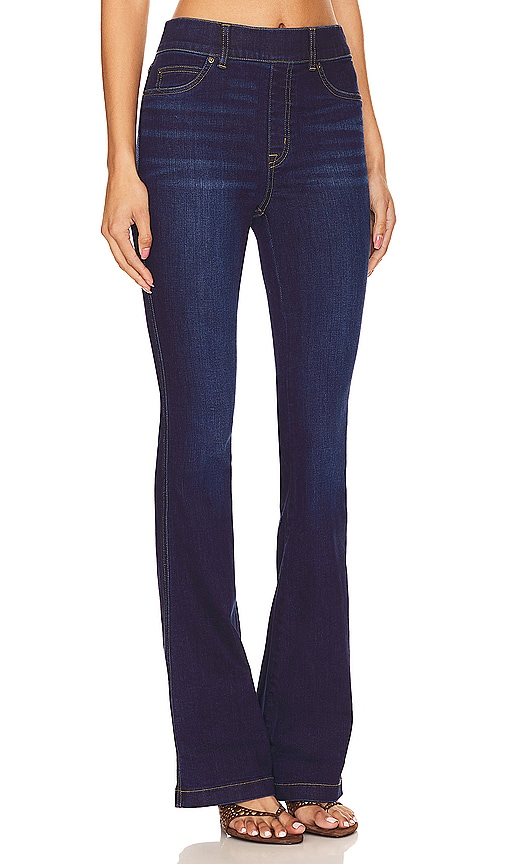 Shop Spanx Flare Jeans In Midnight Shade