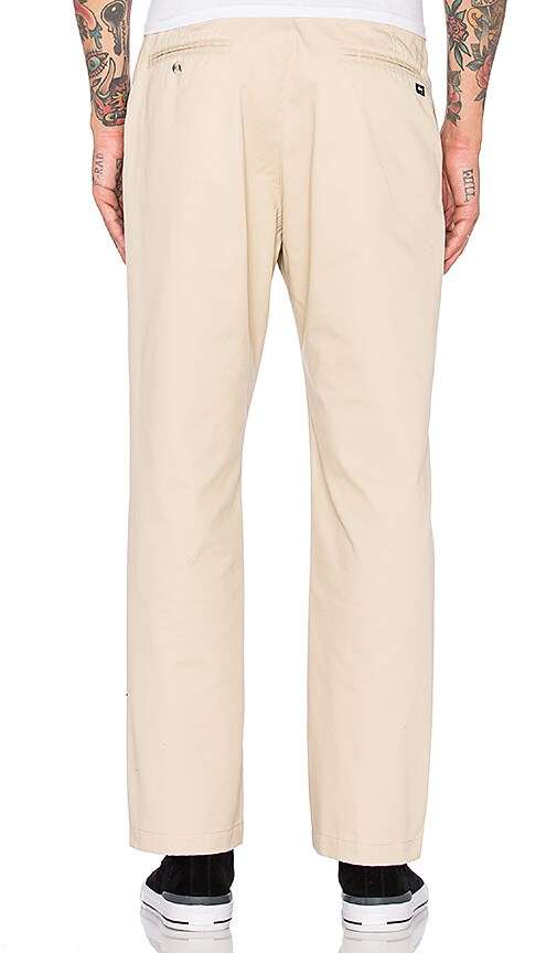 khaki pleated trousers