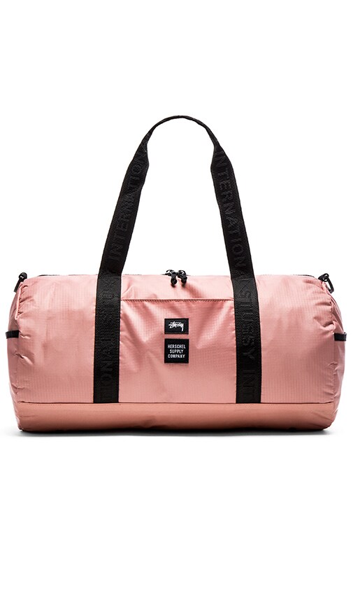 pink herschel duffle bag