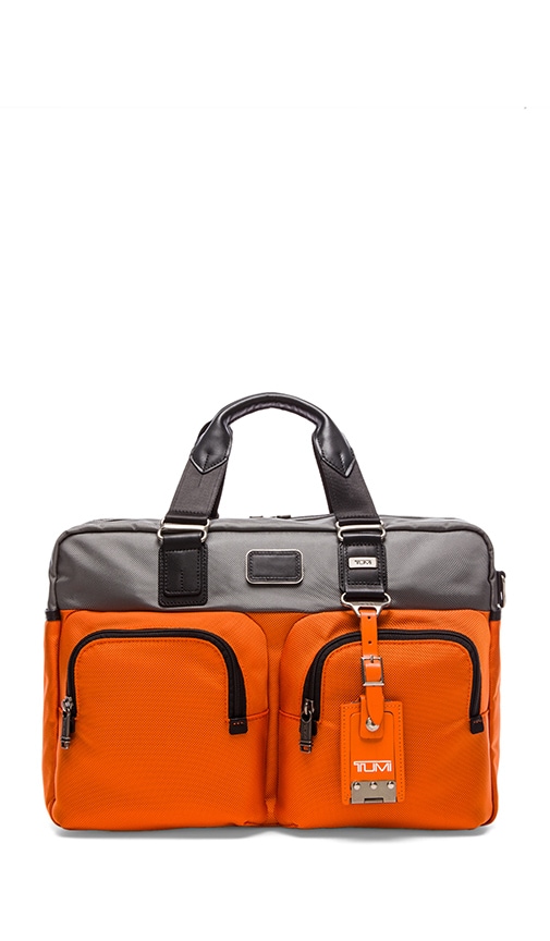 tumi orange luggage