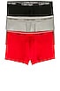 view 1 of 2 Calvin Klein Low Rise Trunk 3 Piece Set in Black, Convoy, & Red Gala