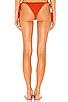 view 3 of 5 Morea Skimpy Solid Ruched Side Tie Bottom in Coral