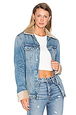 Product image of GRLFRND Daria Oversized Denim Trucker Jacket with Sheep Fur Trim. Click to view full details