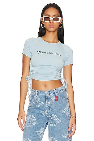 FIORUCCI Ruched Edge Squiggle Logo Tee in Blue | REVOLVE