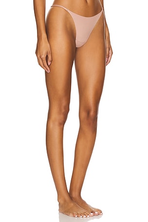 fleur du mal Le Stretch Multifit Micro G-string in Tan. Size 4. Also