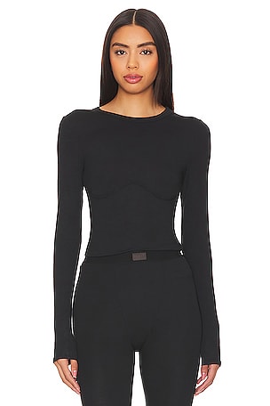 Wolford renames its string bodysuits online; adds sizing reference.