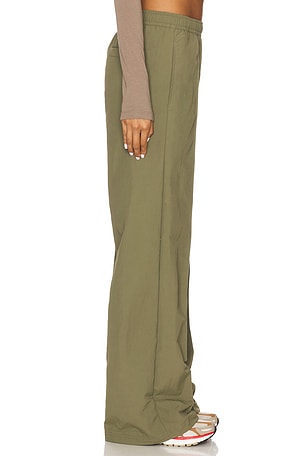 Nike Everythings Woven Mid Rise Open Hem Pant in Olive