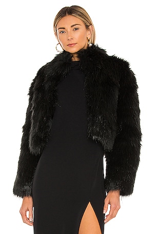 Love this red faux fur jacket over all black.