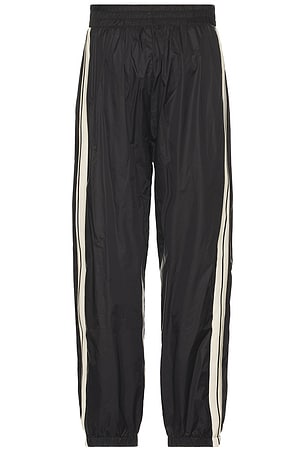 Palm Angels Curved Logo Nylon Track Pants in Black