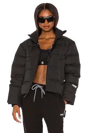 Reebok x Victoria Beckham Cropped Puffer in Black REVOLVE