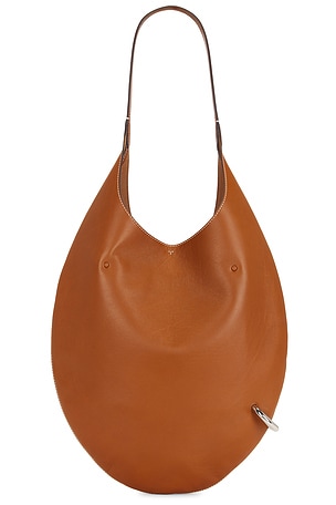 Tory Burch Pierced Soft Bag in Tan