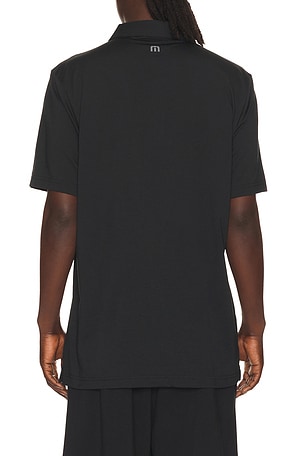 Travismathew performance jersey flight polo en color negro