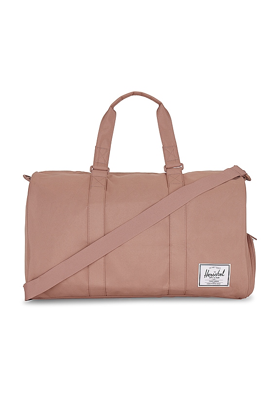 Herschel Supply Co. Novel Duffle in Ash Rose | REVOLVE