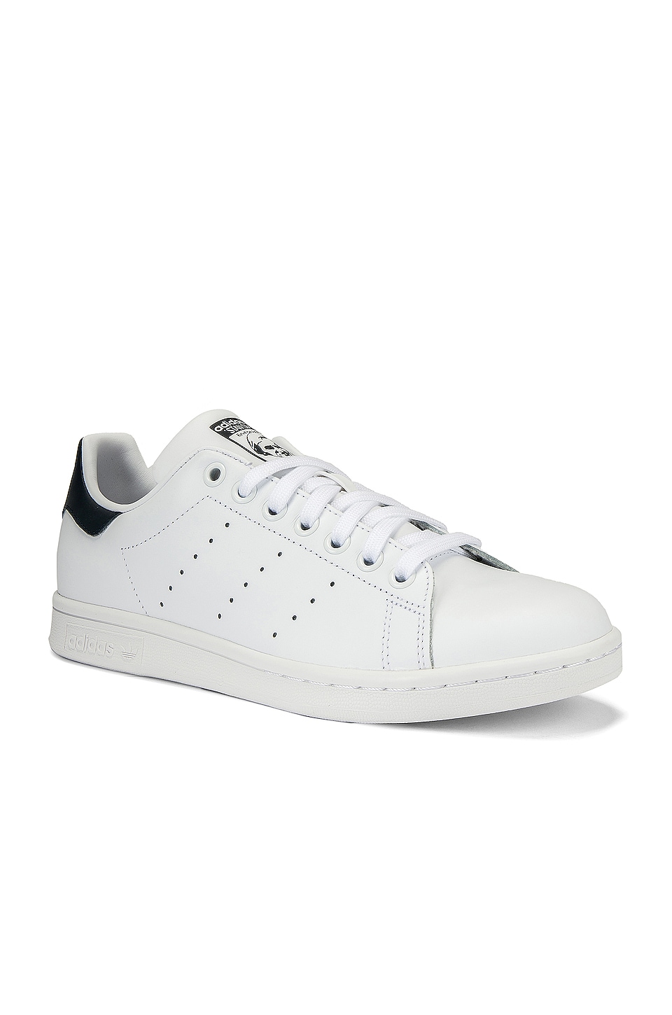 white and blue stan smiths