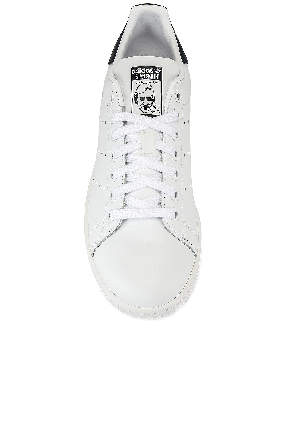 white and blue stan smiths