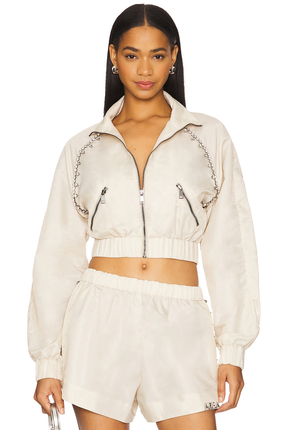 【関税込み】AREA ベージュ Crystal Trim トラックジャケット AREA CRYSTAL TRIM トラックジャケット - Cream | REVOLVE