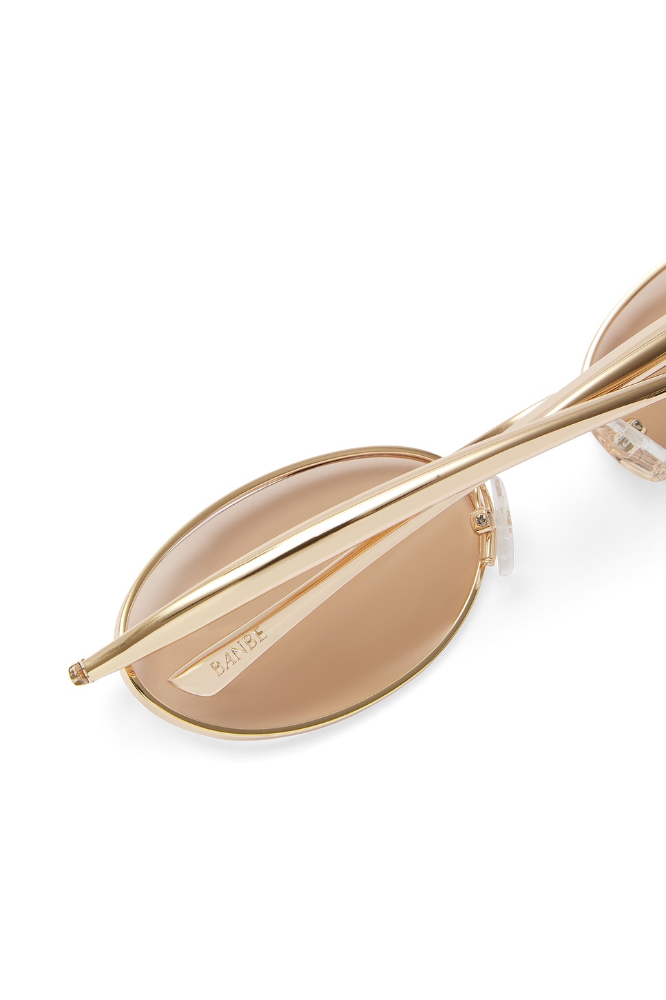 Banbe The Cruz Sunglasses in Gold & Peach | REVOLVE display picture 1