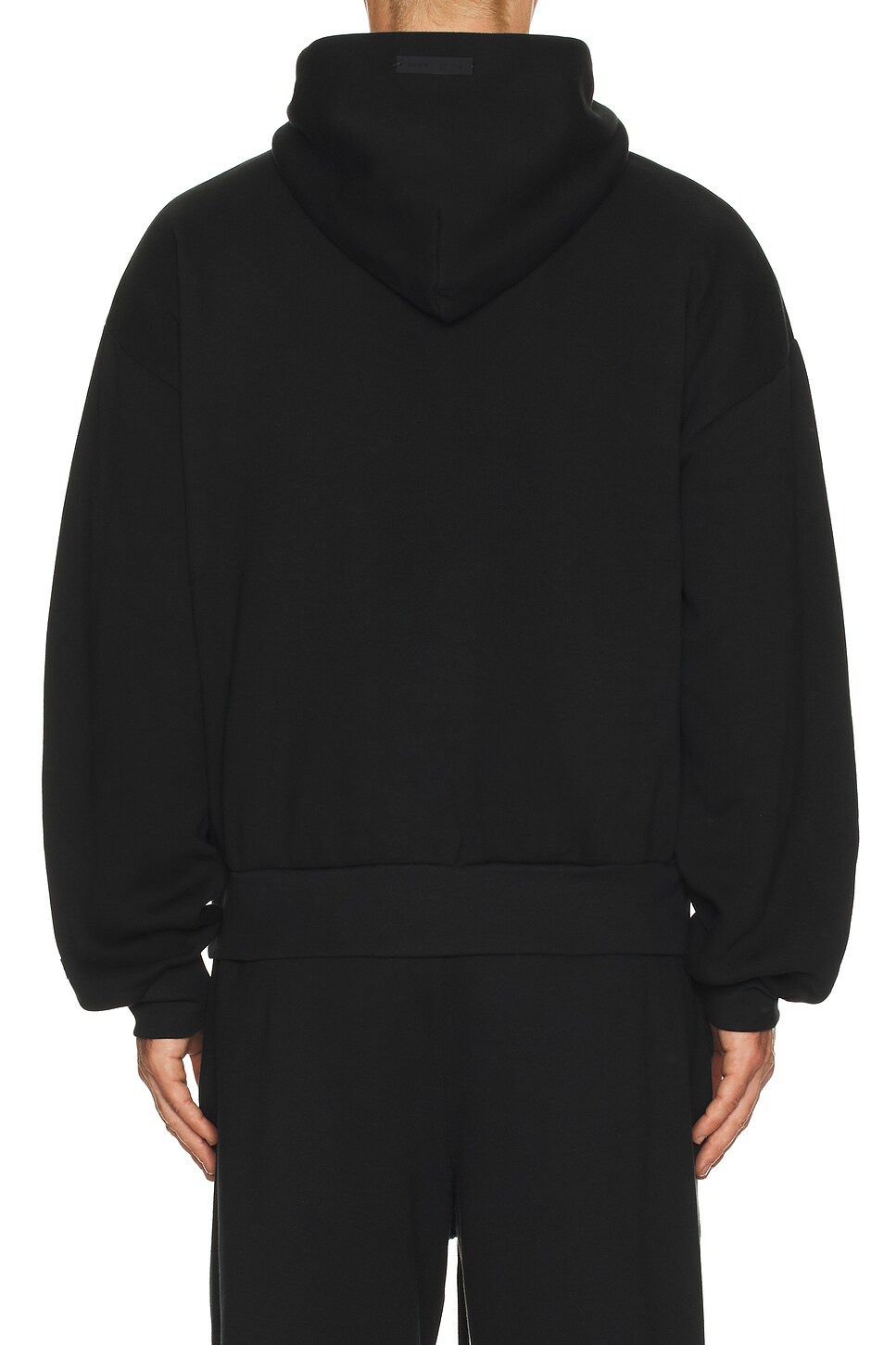 Fear of God ESSENTIALS Classic Hoodie in Vintage Black | REVOLVE