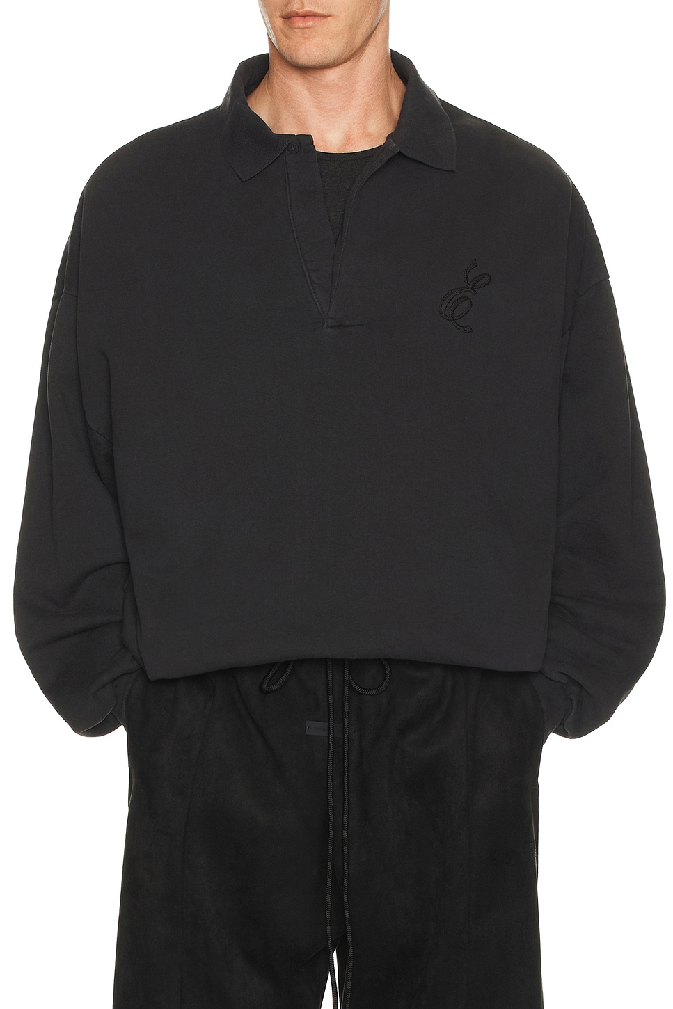Fear of God ESSENTIALS Classic Polo Sweatshirt in Vintage Black | REVOLVE