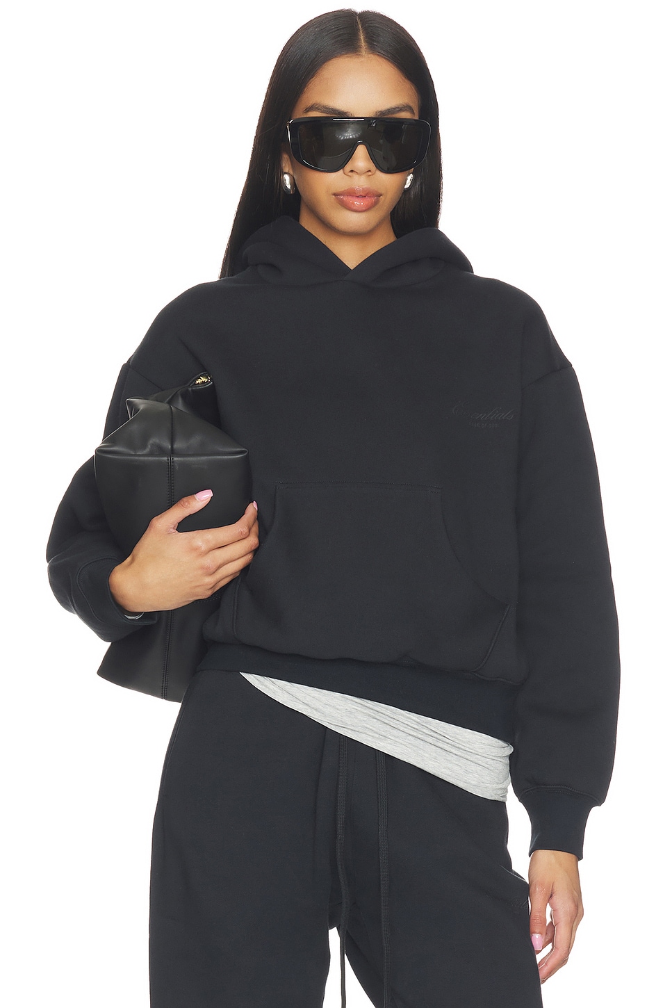 Fear of God ESSENTIALS Classic Hoodie in Vintage Black | REVOLVE
